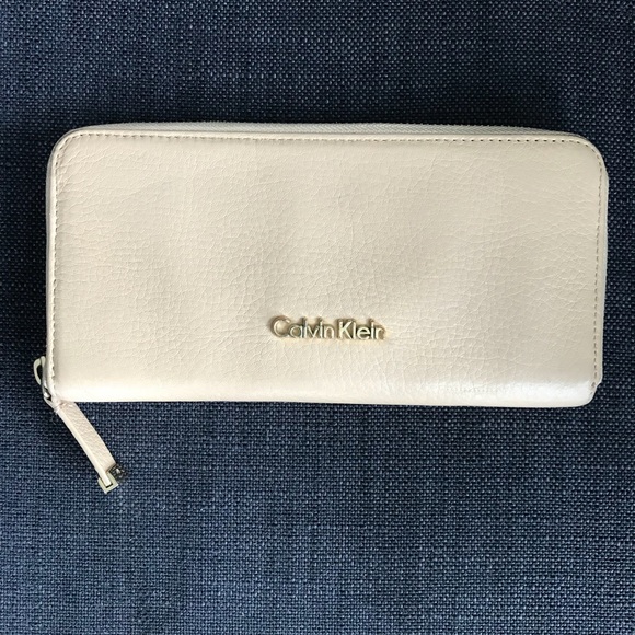 Calvin Klein Handbags - CALVIN KLEIN zip around beige accordion wallet